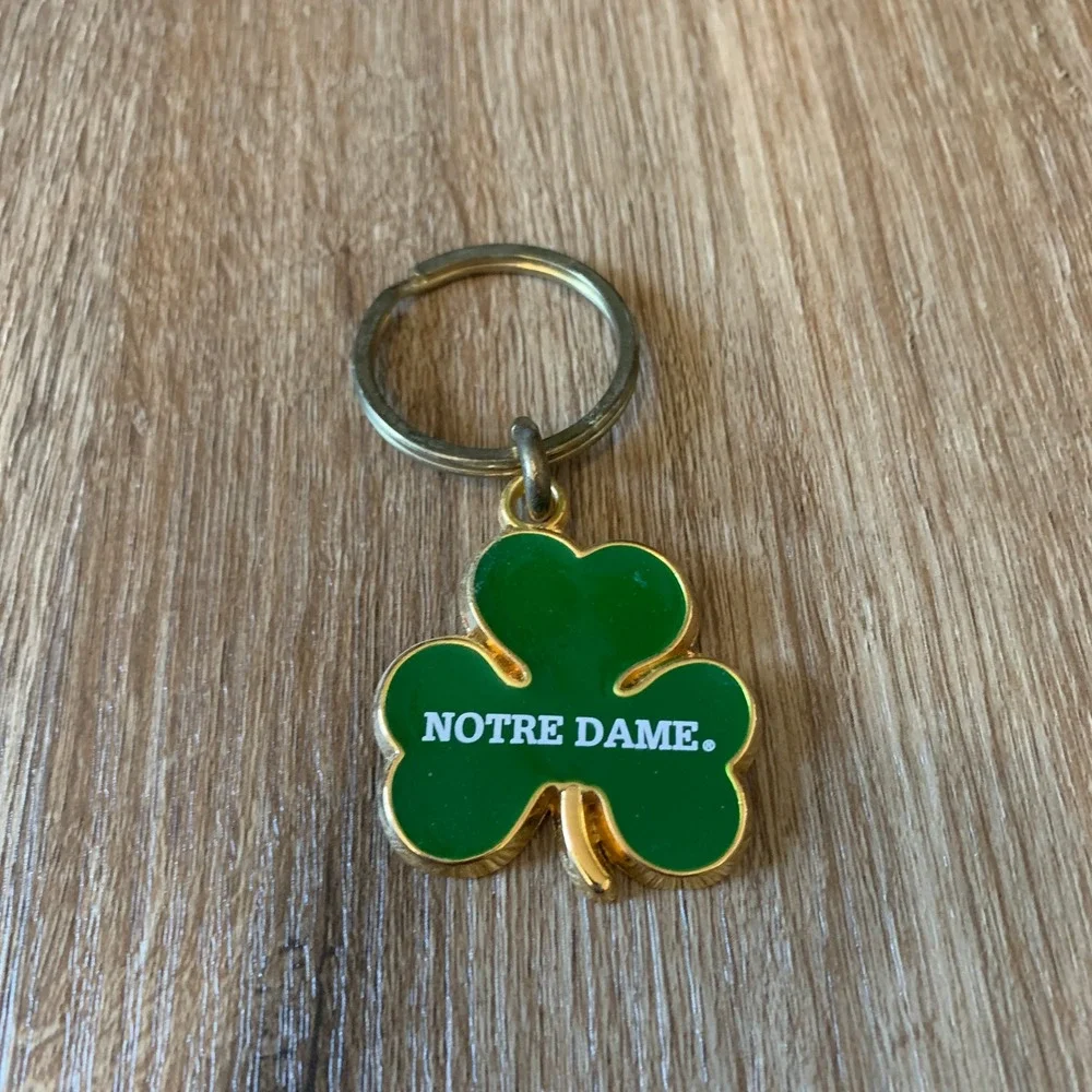 Vintage 90s Notre Dame enameled four-leaf clover keychain in green gold